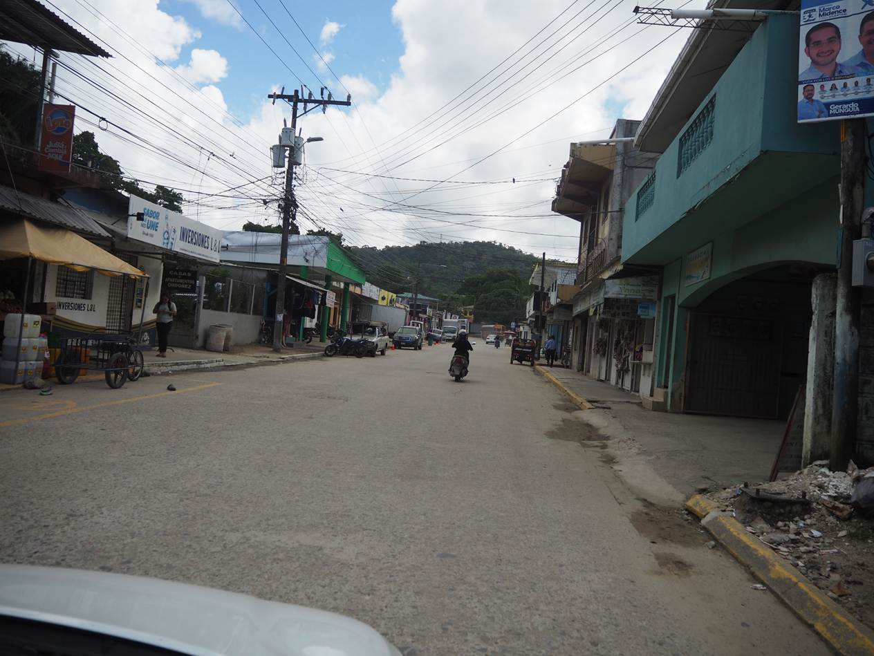 A street with buildings and a motorcycle

AI-generated content may be incorrect.