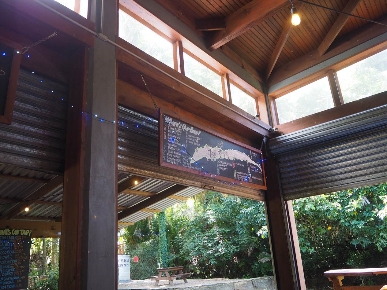 A building with a sign and a table

AI-generated content may be incorrect.